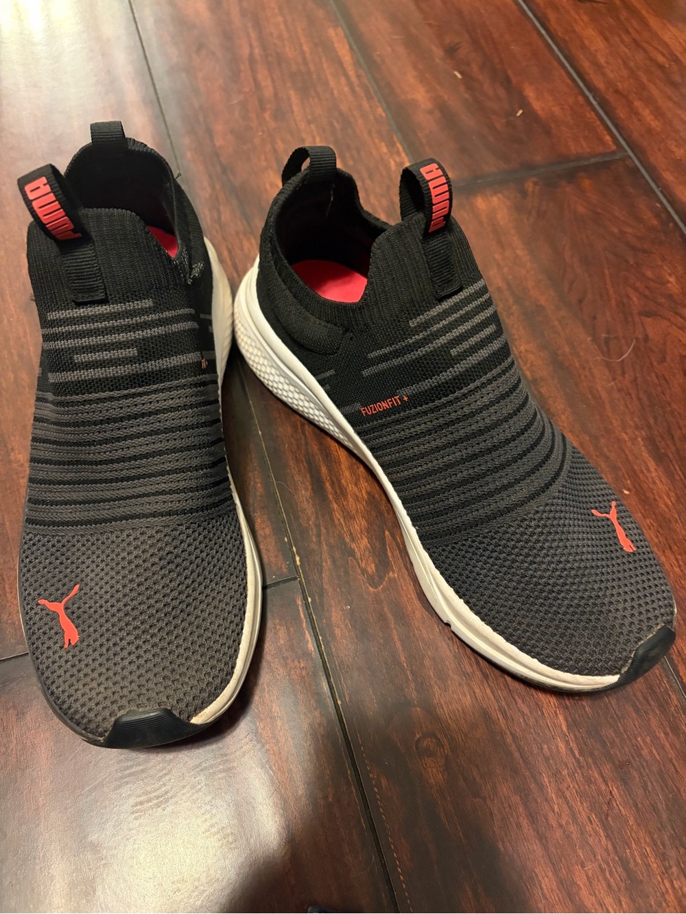 Puma Black Knit Slip-On Sneakers with Red Accents
